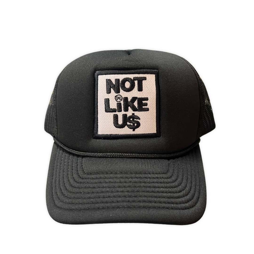 PG Apparel Not Like Us - Trucker hat, front view, men's streetwear